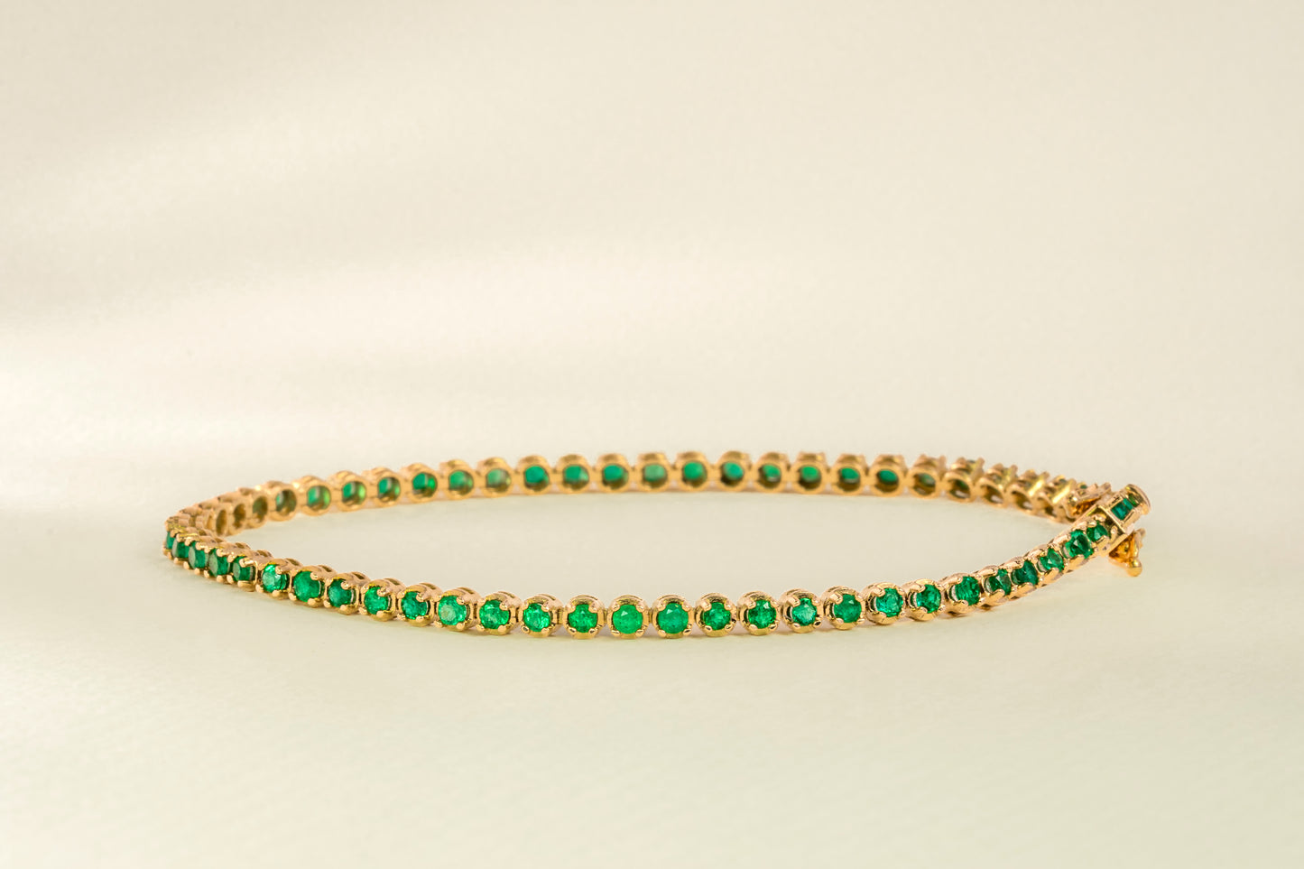 Endless yellow gold with natural emerald - BRA007